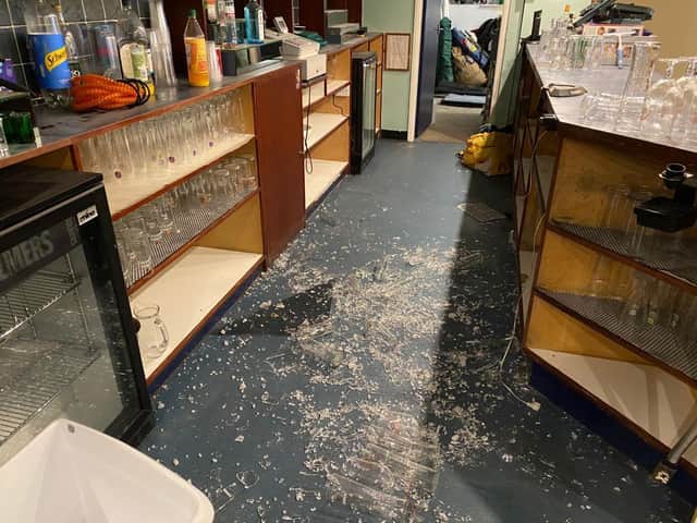 Vandals smash glass inside clubhouse.
