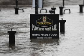 Flood water rises up a sign outside a pub in York as Storm Christoph is set to bring widespread flooding, gales and snow to parts of the UK. Photo: PA