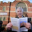 Author Sam Cowgill with a copy of his book.