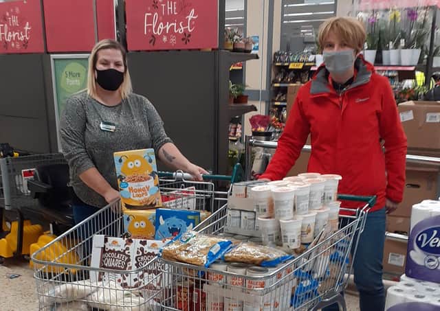 Becky Brown, lead practitioner for student welfare, receives a donation of food from Bridlington’s Morrisons store. Photo submitted