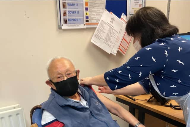 Retired Central Healthcare GP 85-year-old Ronnie Kok receiving his coronavirus vaccine at Lawrence House.