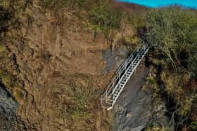 The 'new' metal steps down to Port Dock from Rosedale Lane at Port Mulgrave are the latest casualty from cliff erosion after the heavy persistant rain of the past few weeks. Photo: Alastair Smith