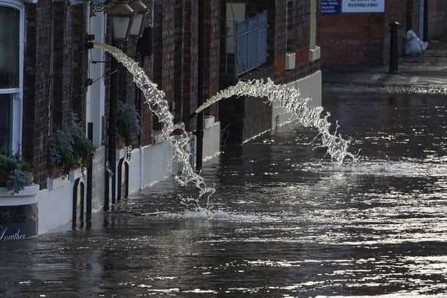 Water being pumped out of riverside properties in York last week.