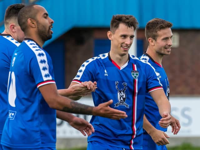 Liam Cooke (centre)