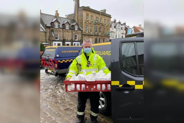 Station Officer Keith Gregory loading some of the food deliveries