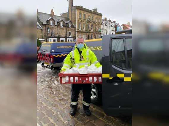 Station Officer Keith Gregory loading some of the food deliveries