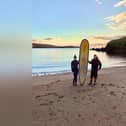 Stephanie Riise and Jake Anderson find Michael Brogan's surfboard washed up on the beach in Shetland - 400 miles from its home!