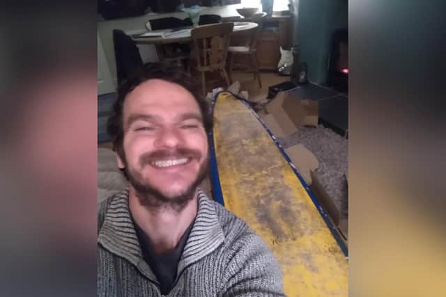 Delighted surfer Michael Brogan has been reunited with his surfboard.