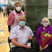 David and Barbara were surprised to be presented with flowers and prosecco
