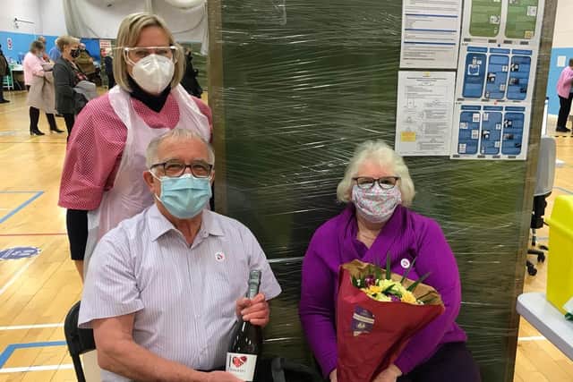 David and Barbara were surprised to be presented with flowers and prosecco