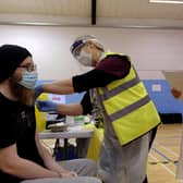 Tom Pickup gets his vaccination at Scarborough's rugby club.