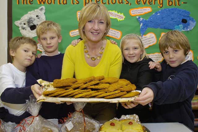 Josh Hargrave, 11, Jake Marshall, 10, Lynne Bennett, Alex Bennett, 8, and Matthew Saywell, 11, at Flamborough School’s Christmas Fair in 2007. (PA0748-23a)