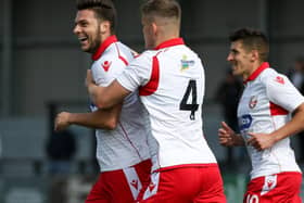 CAPTAIN COATES: Harry Coates, above on the ball against FC United of Manchester, has expressed his pride at being named vice captain of Scarborough Athletic