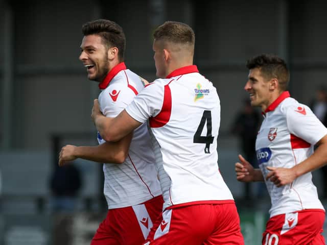 CAPTAIN COATES: Harry Coates, above on the ball against FC United of Manchester, has expressed his pride at being named vice captain of Scarborough Athletic