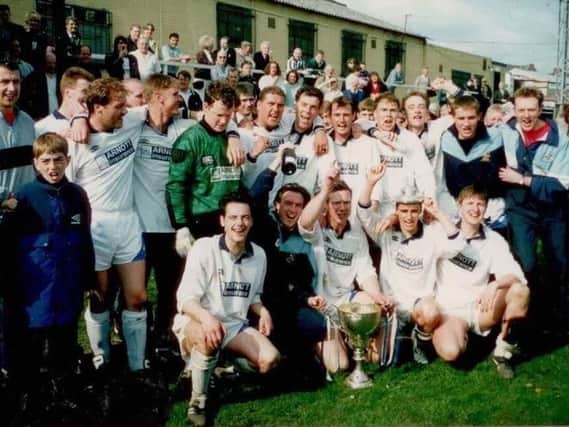 Whitby Town show off the Northern League title silverware after a 7-0 win against South Bank at Ferryhill