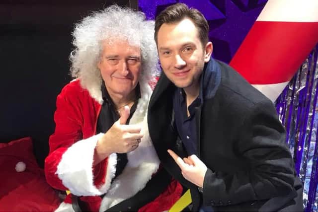 Scott Garnham, who was playing the lead in Nativity in the West End, with the show’s ‘secret Santa’ – Queen guitarist Brian May.