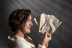 Historian Marie Woods holds love letters written at the height of WWII which were discovered under floorboards of the Esplanade Hotel, Scarborough