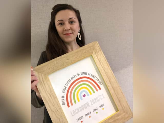 Lindsay Mason with one of her prints.
