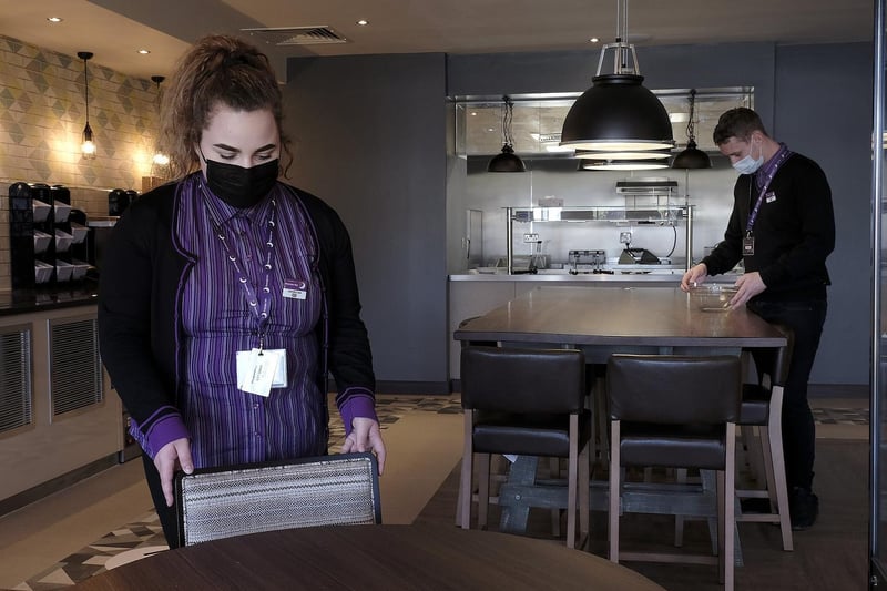 Jamie-lee Owen and Martyn Kelly put the finishing touches to the dining area.
