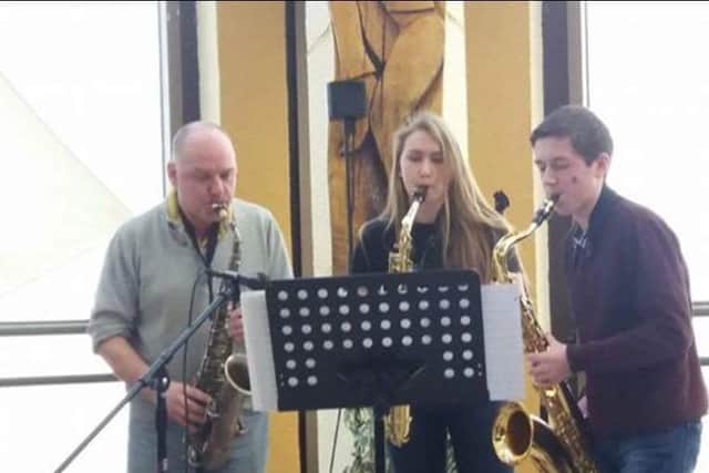 Bob Butterfield and Zak Parlby, who have done the work to create the jazz lunch video, with Maeve Sutterby in the centre.