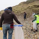 Cleaning the beach at Filey.