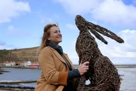 Emma Stothard with one of her sculptures at Staithes Art Festival. Picture: JPI Media