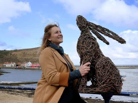 Emma Stothard with one of her sculptures at Staithes Art Festival. Picture: JPI Media