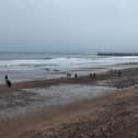 Visitors on Whitby beach over the Christmas period.