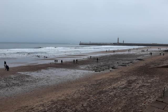 Visitors on Whitby beach over the Christmas period.