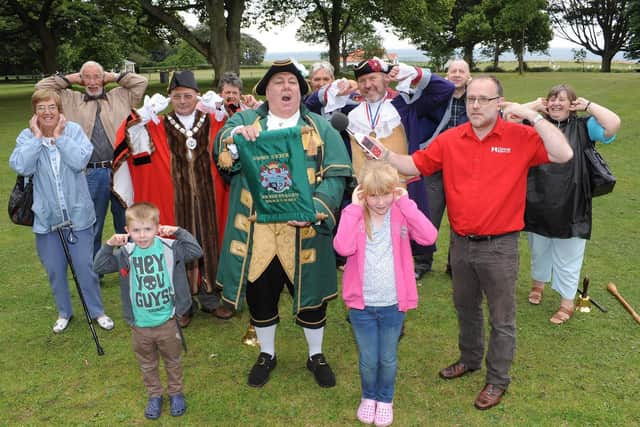 Town Crier David Hinde goes for the UK record at Sewerby Hall and Gardens in 2013. Do you recognise any of the people in the photograph at the event? Photograph taken by Paul Atkinson. (NBFP PA1333-24b)