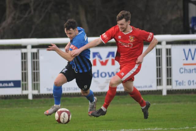 Bridlington Town player of the match Jack Bulless races to get to the ball to before Cleethorpes’ impressive Brody Robertson