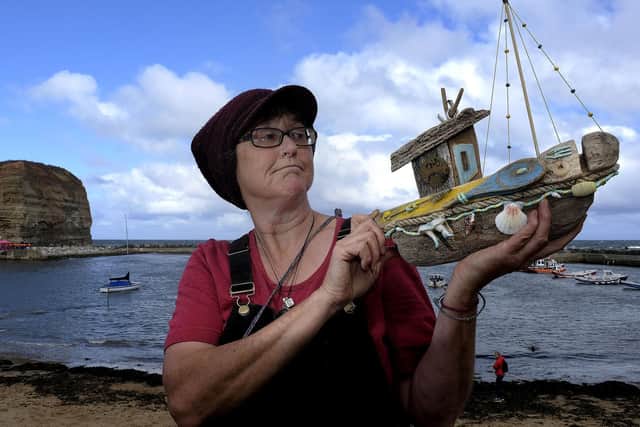 Driftwood artist Sarah Wilson at Staithes Festival of arts and heritage.