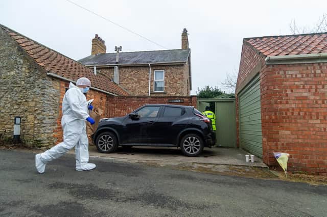 Officers carry out work at the scene of a suspected murder in Thorton-le-Dale.