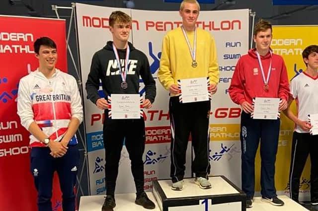 Isaac Hall on the winner's podium