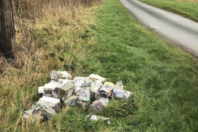 Multiple bundles of phone books were found abandoned on the grass verge of Whins Lane, Long Riston, on November 30 last year.