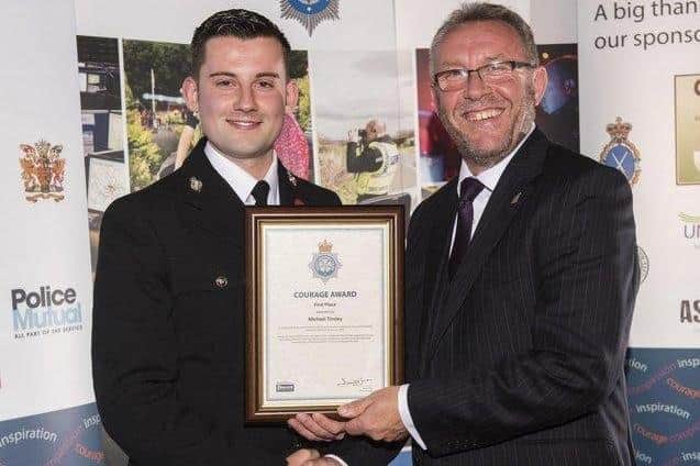 Sergeant Michael Tinsley receiving a bravery award in 2016