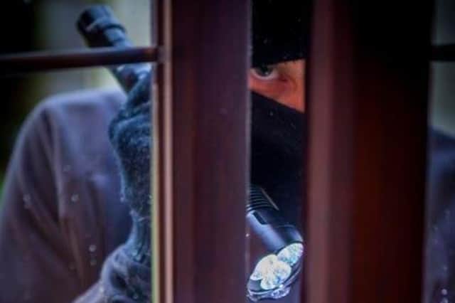 There are opportunistic criminals who take advantage of unlocked windows. Photo posed by a model