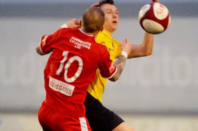 Brid Town boss Brett Agnew challenges for the ball against Pontefract
Photos by Dom Taylor available to order by emailing s70dom@gmail.com or on Facebook at DT Sports Photographs