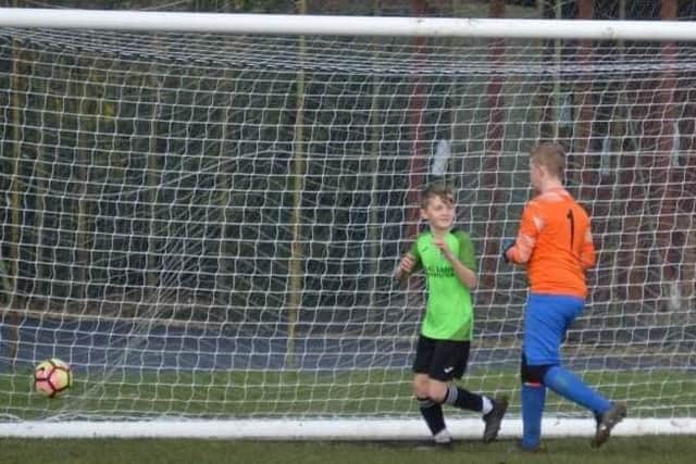 Kobi Crawford hits late winner for Filey Holt Under-13s at Heslerton