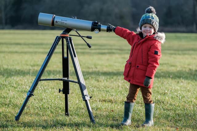 Four-year-old Samuel Startup trying out some astronomy equipment in Dalby Forest. Picture: Tony Bartholomew.
