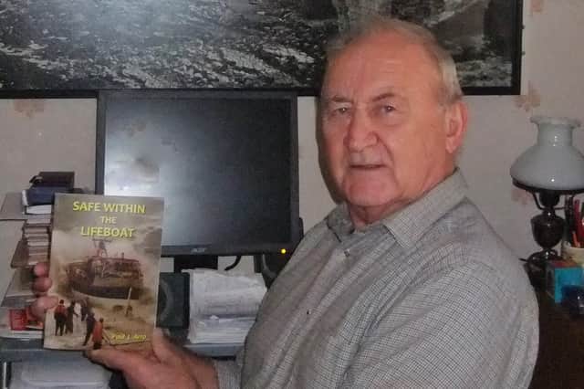 Author Paul L Arro is pictured with his book entitled ‘Safe Within The Lifeboat’.