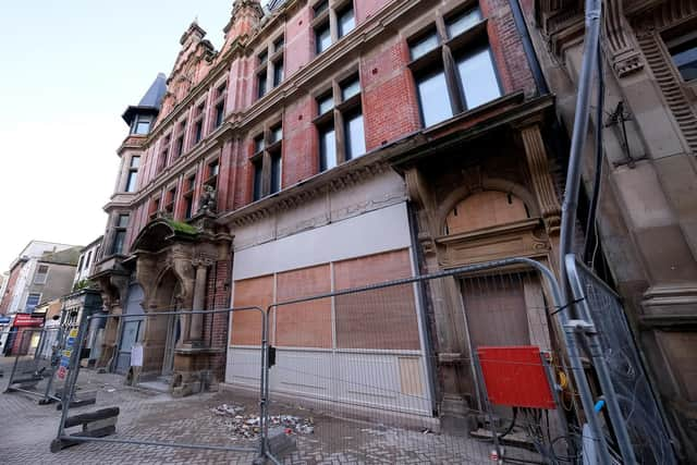 Building work has ceased at the site, which is boarded up and surrounded with metal fencing.