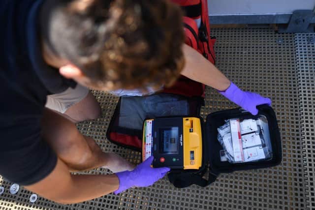 The defibrillator can help to save someone's life when used within minutes. (Photo by BEN STANSALL/AFP via Getty Images)