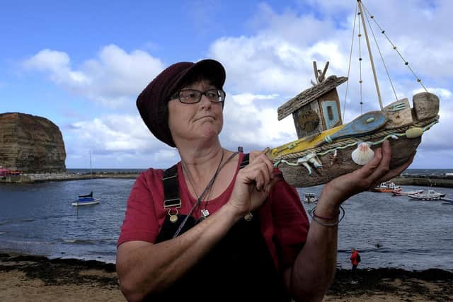 Driftwood artist Sarah Wilson at the Staithes Festival of Heritage and Arts.
194425k