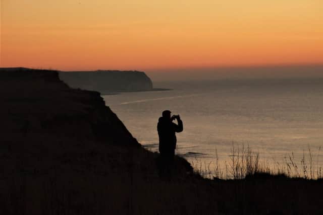 Alan Flynn focuses on a beautiful sunrise over Sewerby.