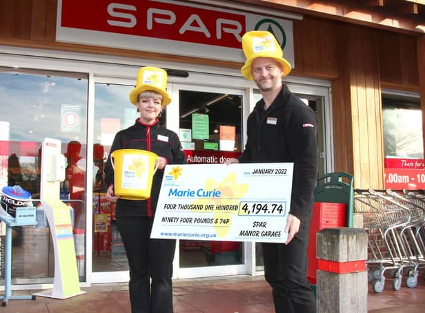 Staff at East Ayton SPAR with a cheque for £4,194