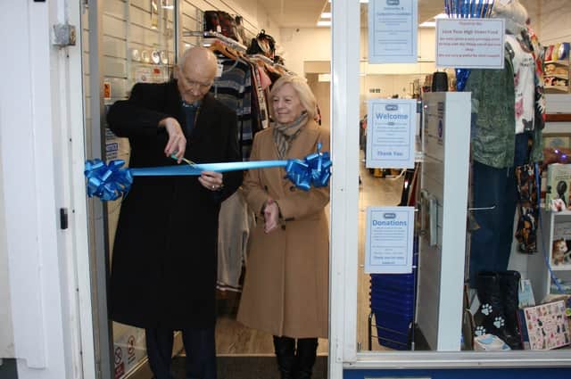 Cllr Chad Chadwick and Honorary Alderwoman Margaret Chadwick officially open the new RSPCA shop on Prospect Street (inset).