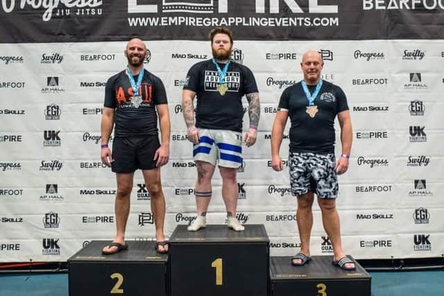 Smoothflo Academy’s Mikie Holis, centre, won the Advanced and Elite over 95kg division at the Empire Grappling Competition