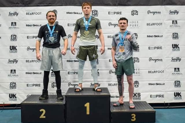 Coach Sam Barker won a gold medal at the Empire event