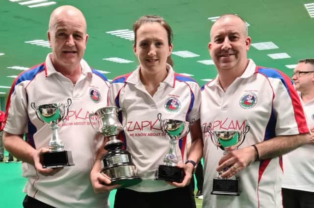 the winning England team of, from left, Lawrence Moffatt, Bronagh Toleman and Lee Toleman with the British Isles triples trophies